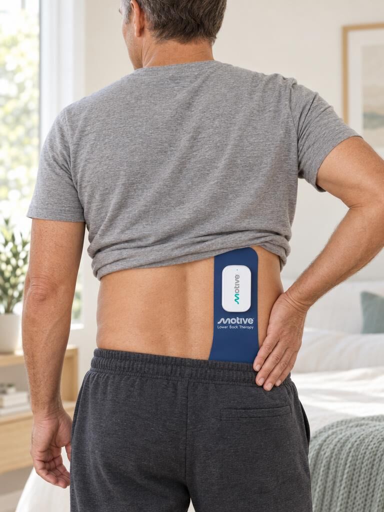 Motive therapy pad worn across the lower back and glute