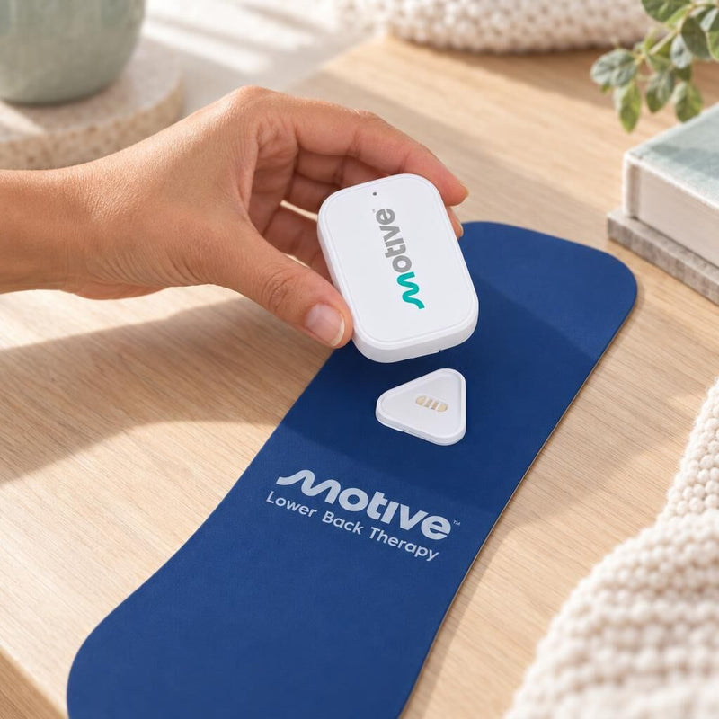 Snapping the Motive device onto the therapy pad